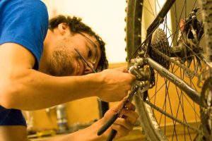 worker repairing a bike in the bike shop